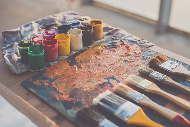istock Painter workplace. Palette with brushstrokes and paintbrushes. Colorful gouache, crayons 635986970