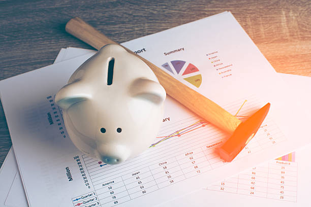 istock Piggy bank with hammer. 635987084