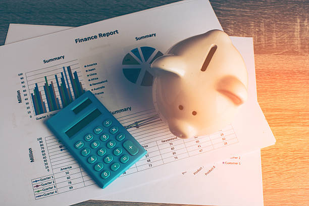 istock Piggy bank with business stuff. 635987170