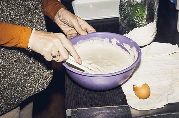 istock Woman making pancakes mixture. 635987474