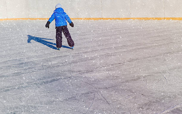 istock little boy skating in winter nature 635987750