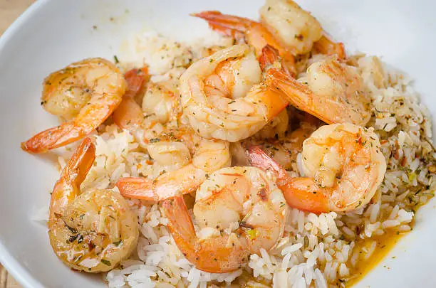 Cajun style barbecue shrimp and white rice.