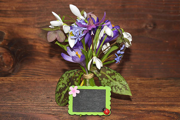 istock Spring bouquet of flowers on wood 635988196