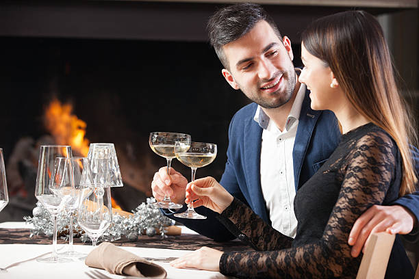 istock Young Couple on a Romantic Date in a Restaurant 635988488