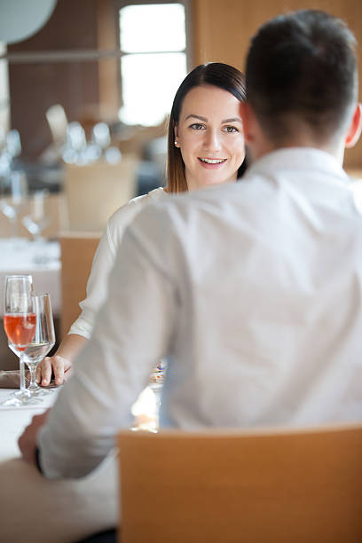 istock Young Couple on a Romantic Date in a Restaurant 635989884
