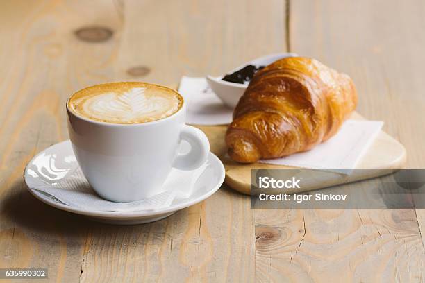 Coffee And Croissant On A Wooden Table Stock Photo - Download Image Now - Coffee - Drink, Croissant, Breakfast