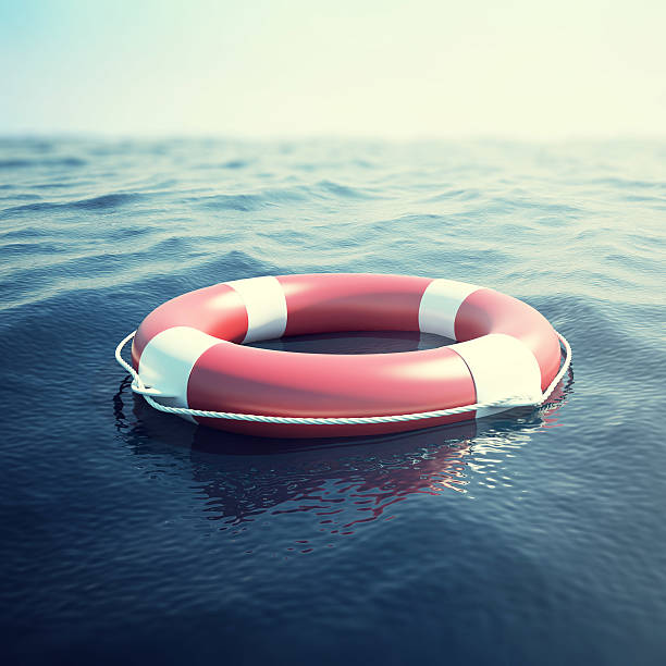 istock Red life buoy on the waves as a symbol of 635990752