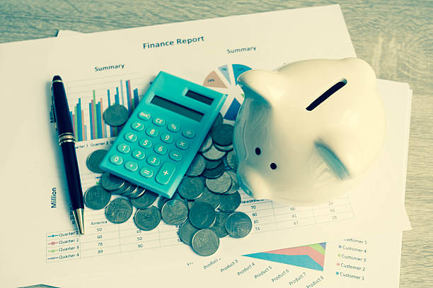 istock Piggy bank with business stuff. 635993760