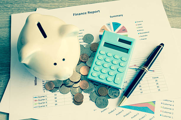 istock Piggy bank with business stuff. 635993796