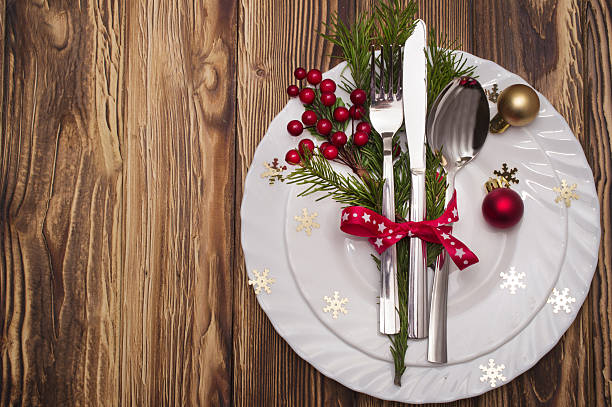 istock Christmas table place setting with pine branches,ribbon and bow. 635994494