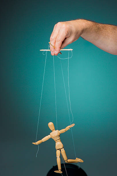 istock Image puppet in the hands of the puppeteer 635997280