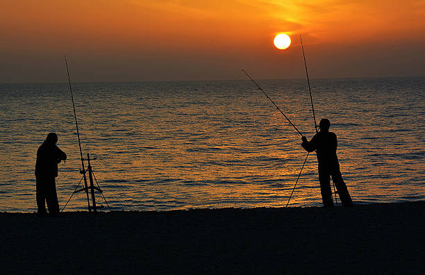 istock Sunset fishing 635997310