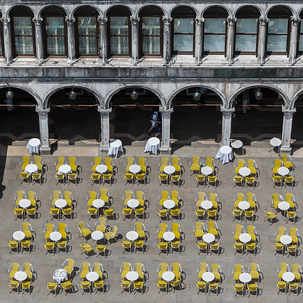 istock Red and Yellow Chairs Round Tables Aerial View Saint Mark 635997714