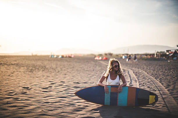 istock Lonely surfer girl 635998636