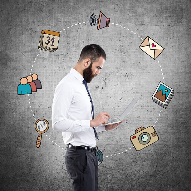 istock Businessman with infographic icons 635998668