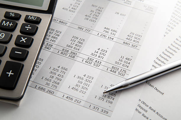 istock Pen, calculator On the financial account documents. Financial co 635999724