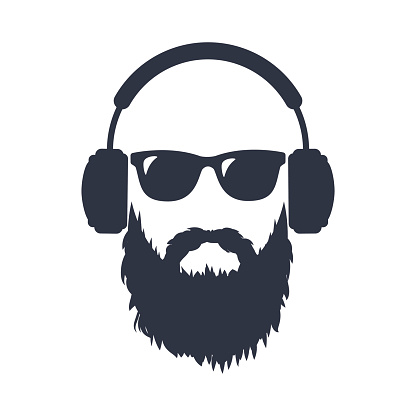 Bearded man in sunglasses and headphones