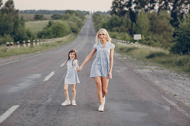 istock mom and daughter outside 636004958