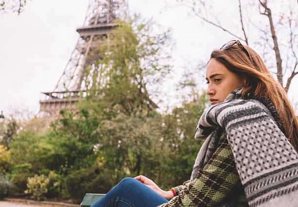 Thoughtful woman in the park