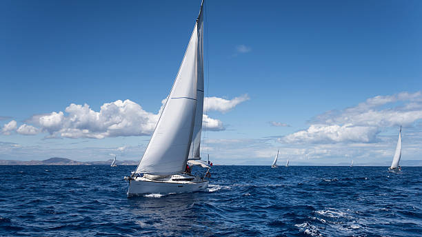 Yachting regatta in the Mediterranean sea Yachting regatta in the Mediterranean sea near the Syros island yachting stock pictures, royalty-free photos & images