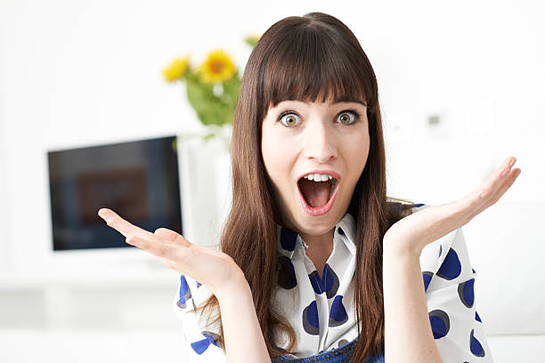 istock Young Woman Making Shocked Gesture With Hands 636010730