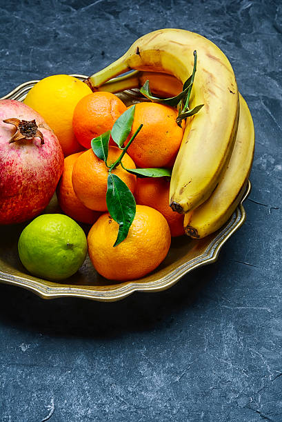 istock Dish with tropical fruits and citrus 636011882