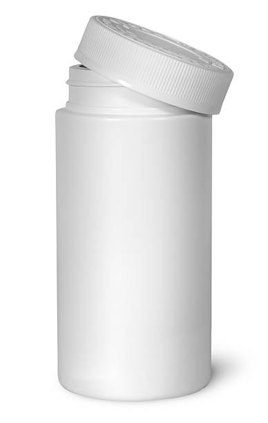 istock White plastic bottle for vitamins with lid removed 636012672