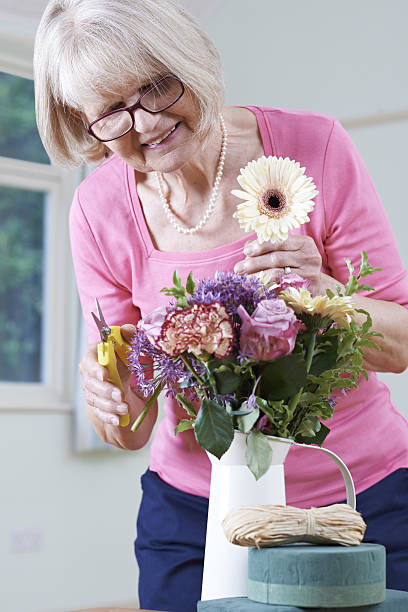 Senior Woman In Flower Arranging Class