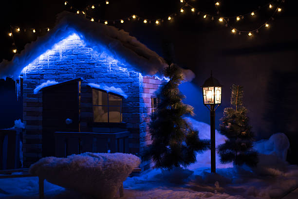 istock Small wooden lodge is decorated with a Christmas lights 636018686