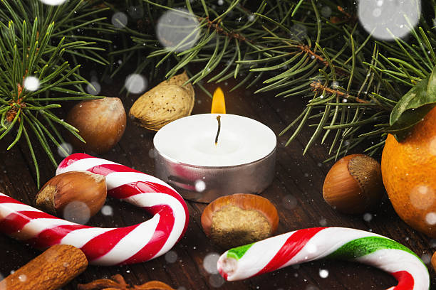 istock Christmas jewelry - candles, fir-tree branches, nuts, cinnamon 636026256