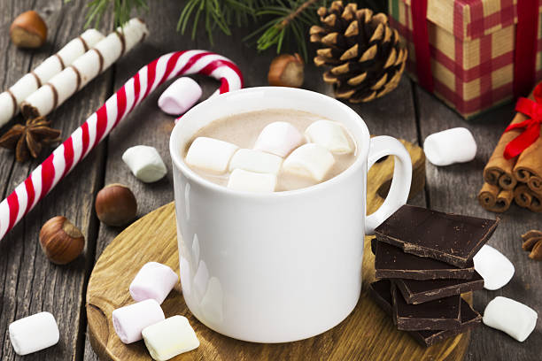 istock Cup of hot cocoa with marshmallows on a dark background 636026432
