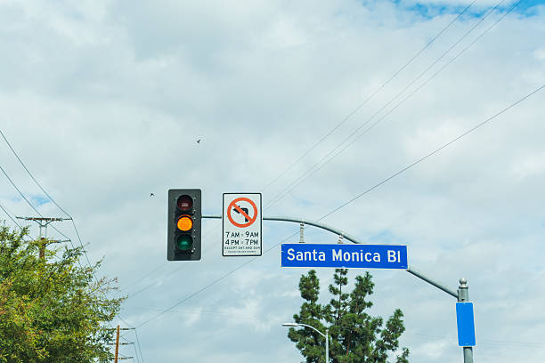 santa monica boulevard sign under a cloudy sky - highway 99 imagens e fotografias de stock