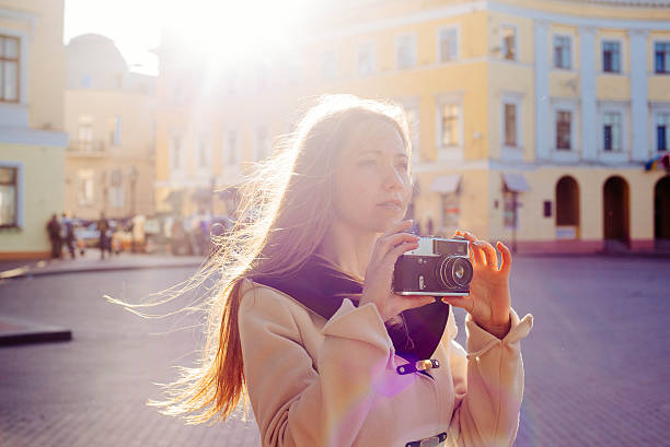 istock young female with vintage camera outdoor 636028324