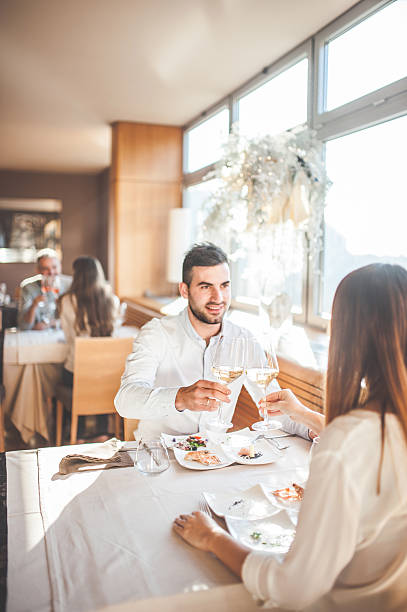 istock Young Couple on a Romantic Date in a Restaurant 636028648