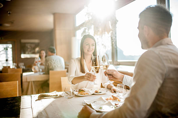 istock Young Couple on a Romantic Date in a Restaurant 636028694