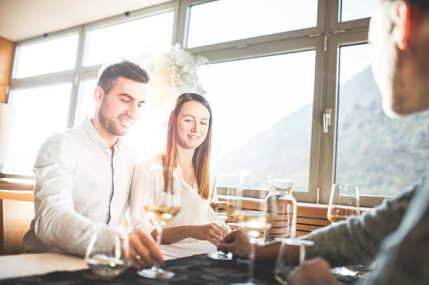 istock Young Couple on a Romantic Date in a Restaurant 636028728