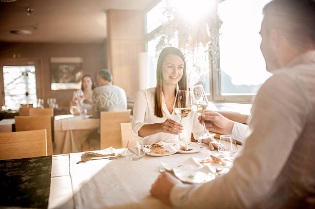 istock Young Couple on a Romantic Date in a Restaurant 636028756