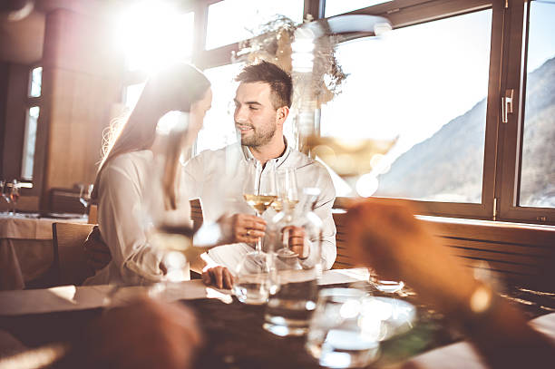 istock Young Couple on a Romantic Date in a Restaurant 636028824