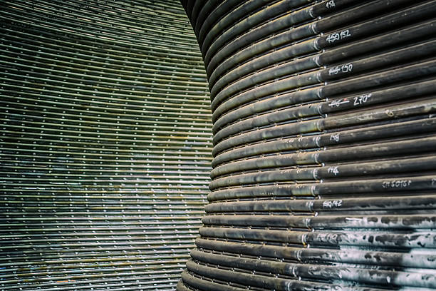 Metal tunnel background Metal tunnel made of rounded steel pipes. deconstruct stock pictures, royalty-free photos & images