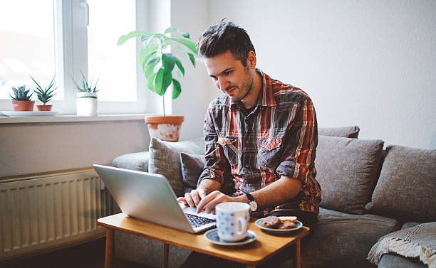 istock Young man doing a freelance job from home 636032822