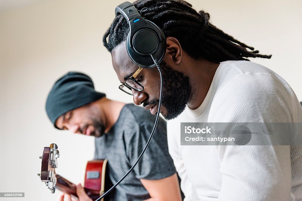 Artists producing music. Artists producing music in their home sound studio. Adults Only Stock Photo