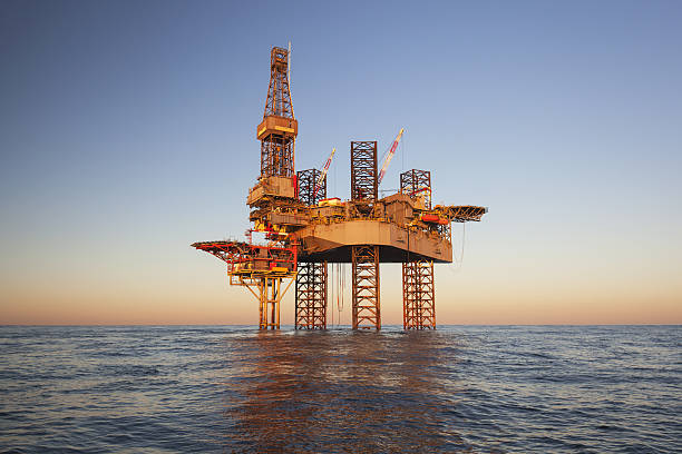 An offshore oil drilling rig stock photo