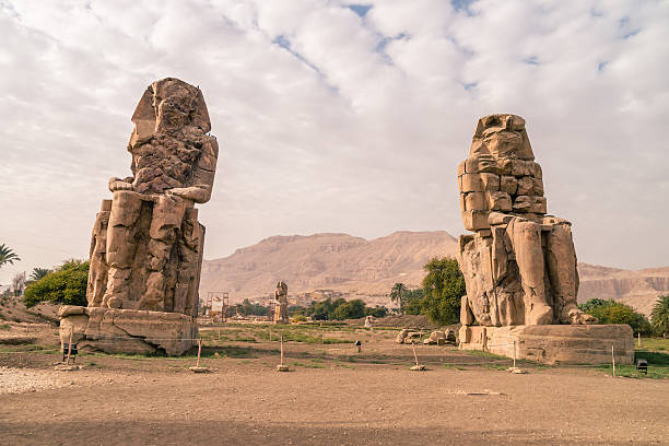 istock LUXOR, EGYPT Ancient Colossi of Memnon in Egypt at noon. 636033934