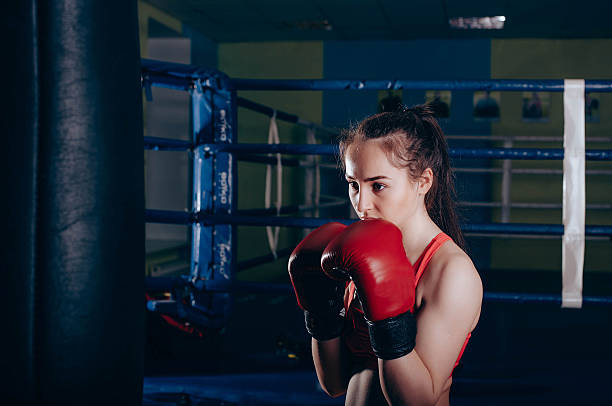 istock girl boxing in gym 636034854