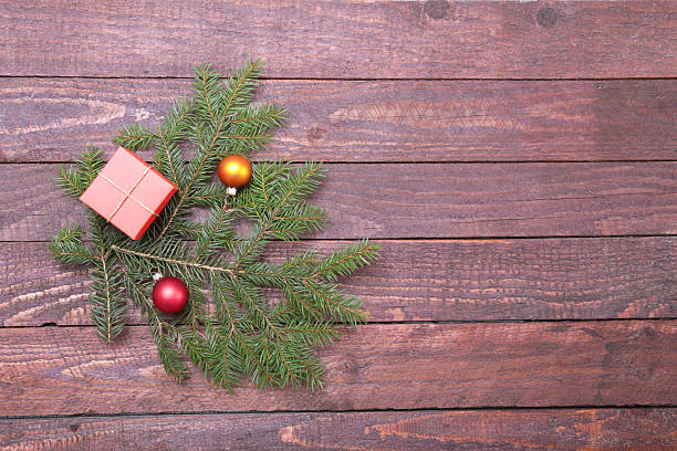 istock Gift box with christmas tree on wood background 636035244