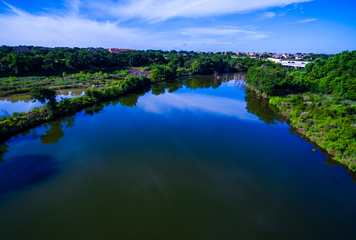 Paradise above brushy creek lake park Austin Texas  Near round rock TX. This amazing mirrored image aerial shot above the Brushy creek lake shows a perfect blue sky reflected in nice blue waters with a natural Texas hill country landscape 
