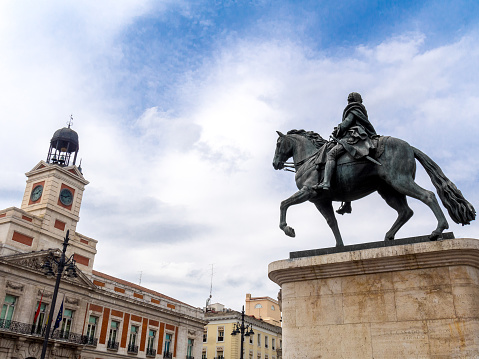 Puerta del Sol square in Madrid, with Casa de Correos at the left and the equestrian statue of Carlos III at the right