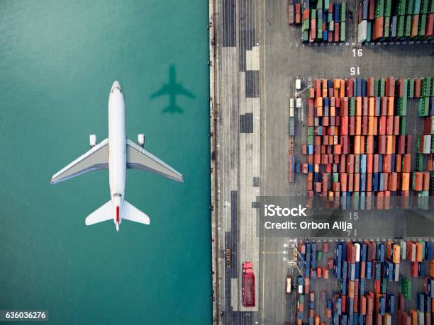 Airplane Flying Over Container Port Stock Photo - Download Image Now - Freight Transportation, Airplane, Cargo Container