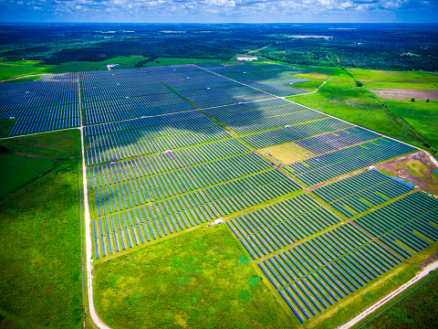 Solar Energy Summer Sunshine Solar Panel Power Plant. Solar Panel Power Plant Aerial Shot over Texas Hill Country Austin Texas USA Clean Renewable Energy providing solar power to thousands of Homes across central Texas.