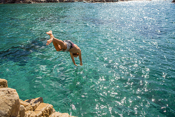 Close-up little child is swimming in the sea